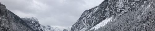 Black lake in Austrian winter and mountains