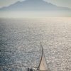 Sail yaght near Gibraltar with Moroccan mountains in the background